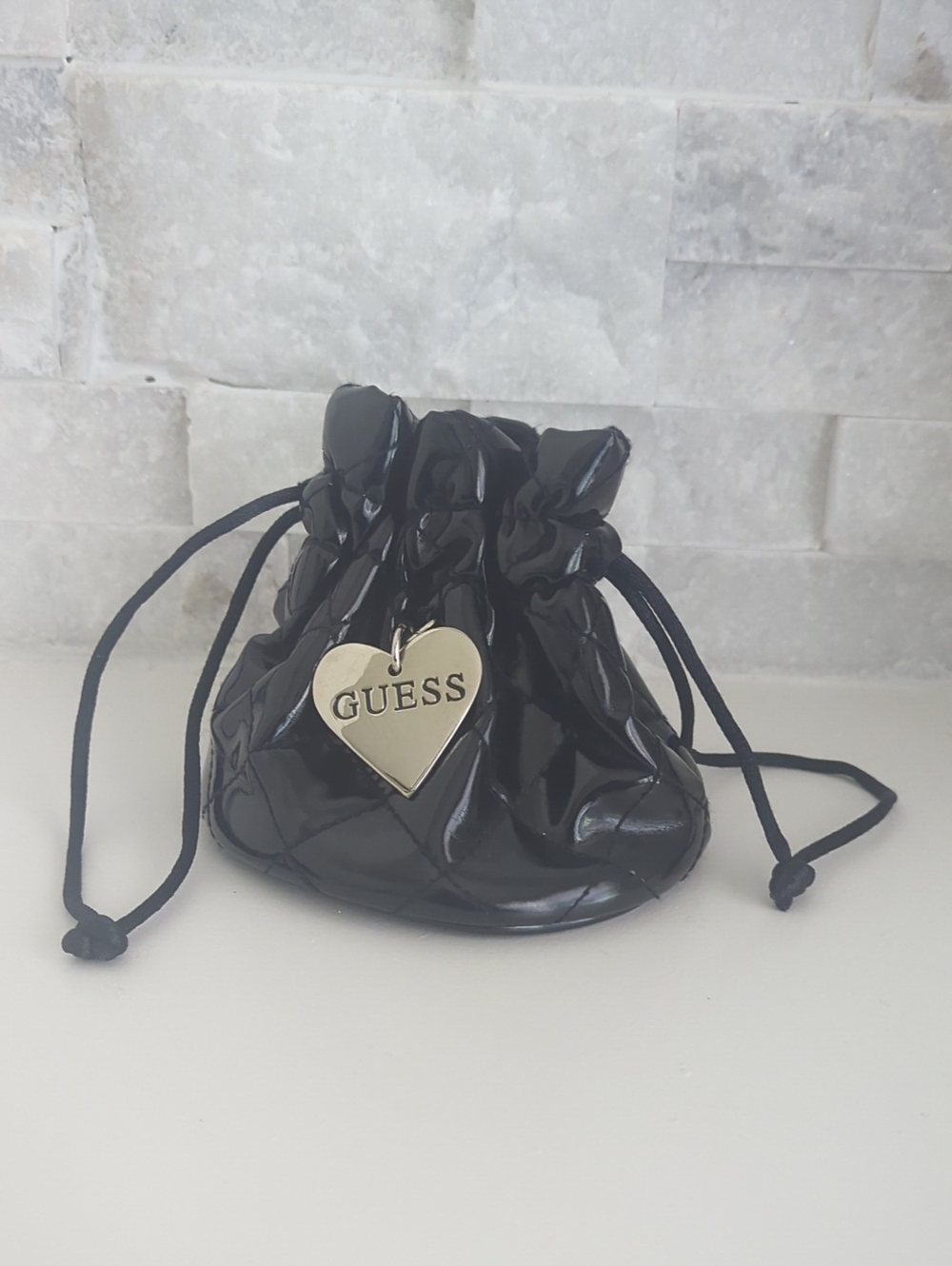GUESS Black Patent Drawstring Pouch with Gold Heart Logo NWOT